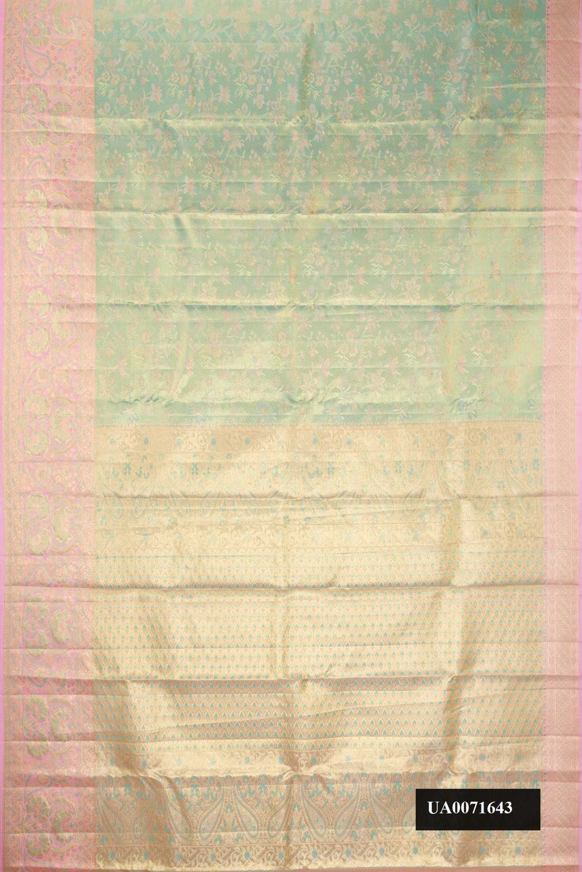 Pista Green Dual Tone Kanchipuram Tissue Silk Saree with Zari Brocade on the body and Fancy Border.  displayed on a mannequin
