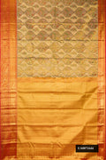 Gold Dual Tone Kanchipuram Tissue Silk Saree with Zari Brocade on the body and Zari Border.  displayed on a mannequin
