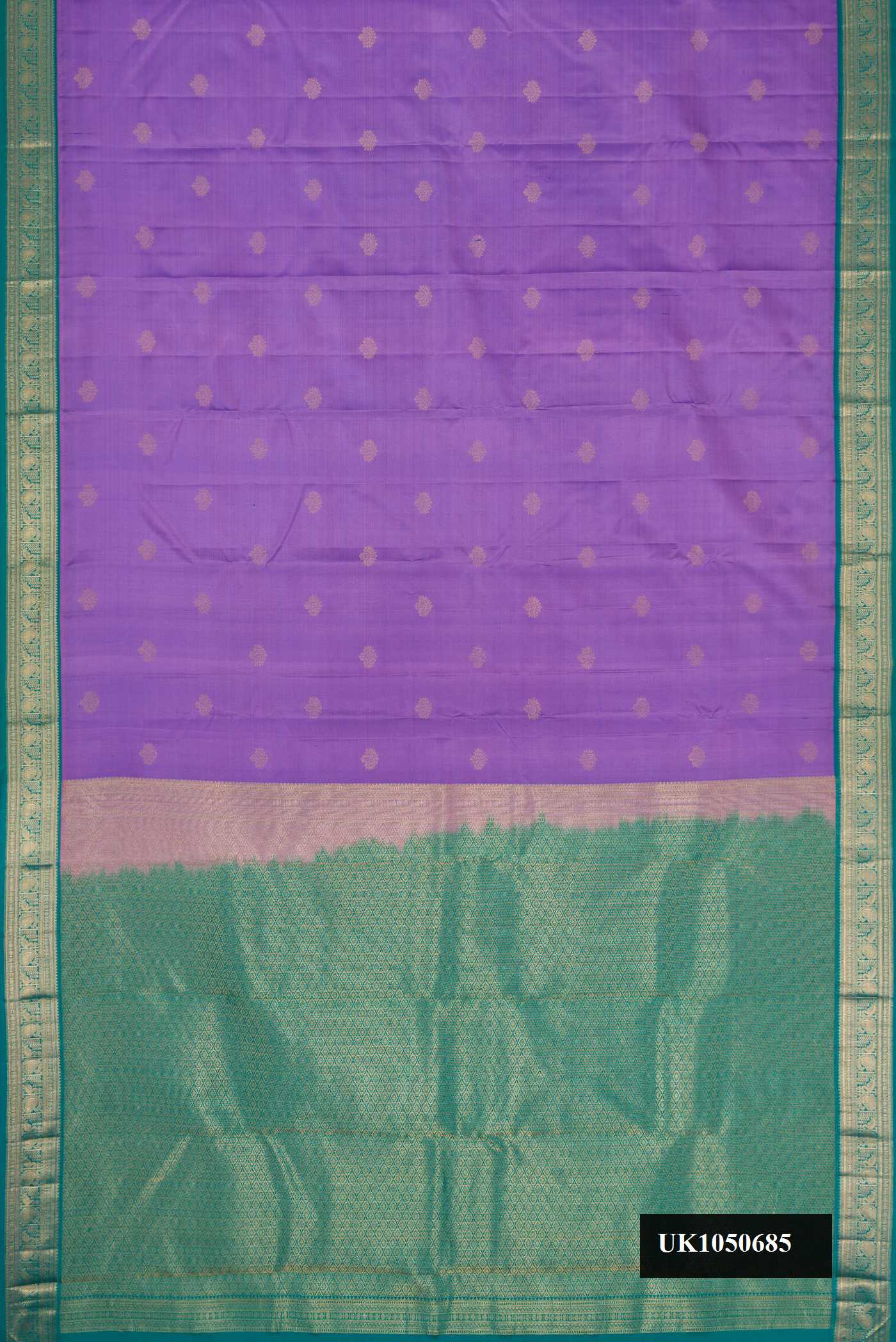 Lavender Dual Tone Kanchipuram Silk Saree with Zari Butta on the body and Zari Border.  displayed on a mannequin