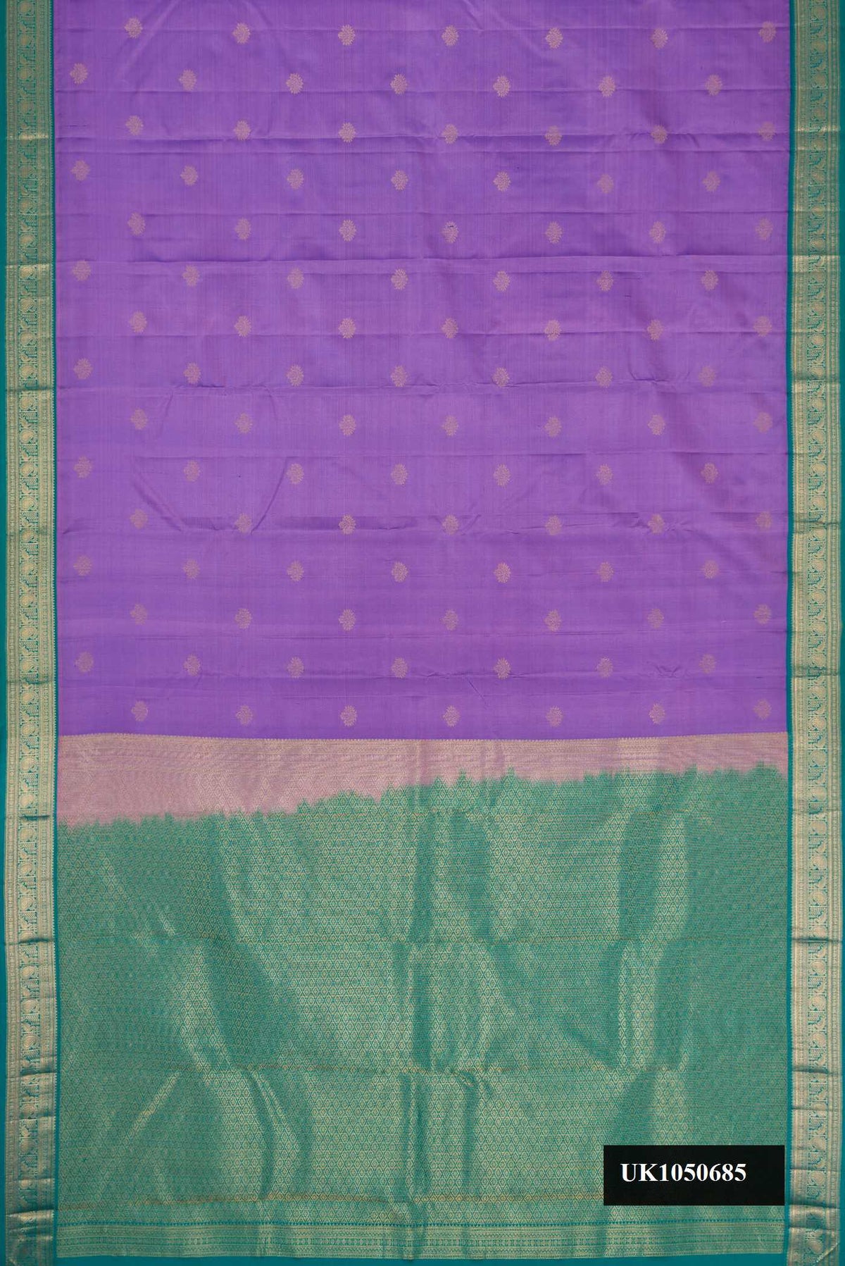 Lavender Dual Tone Kanchipuram Silk Saree with Zari Butta on the body and Zari Border.  displayed on a mannequin