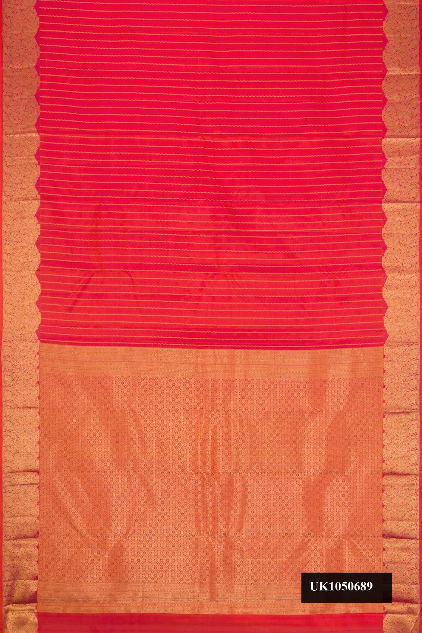 Red Dual Tone Kanchipuram Silk Saree with Stripes on the body and Fancy Border.  displayed on a mannequin