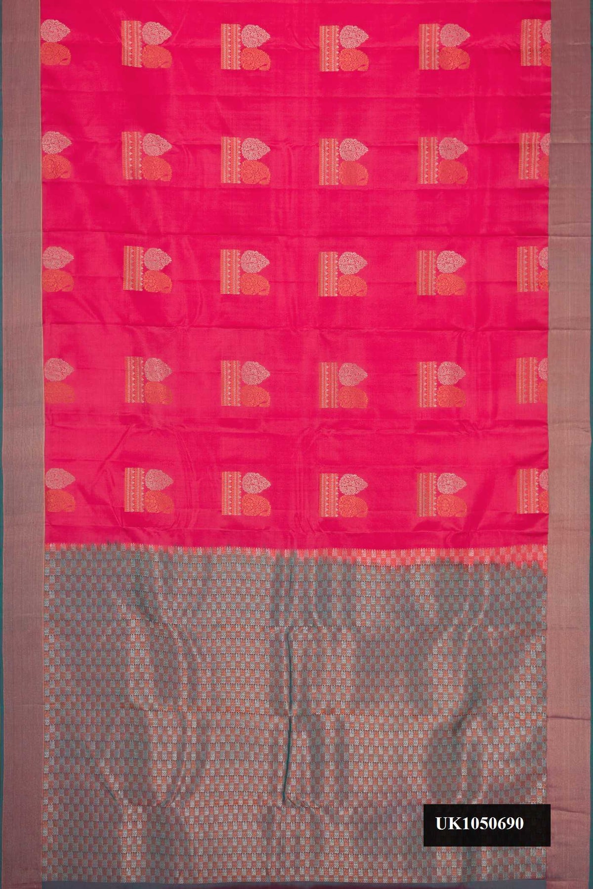 Pink Dual Tone Kanchipuram Silk Saree with Zari Butta on the body and Zari Border.  displayed on a mannequin