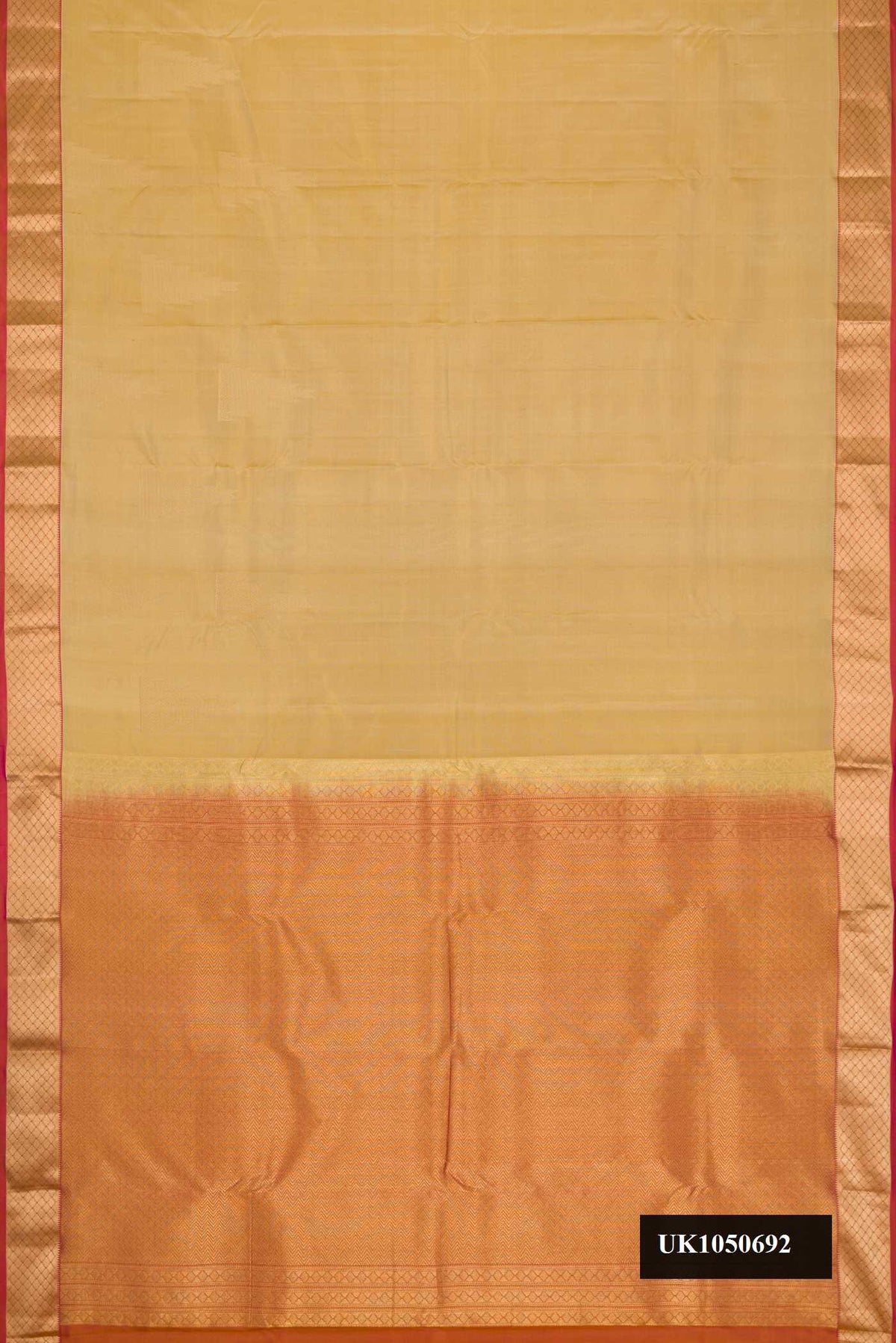Dark Beige Dual Tone Kanchipuram Silk Saree with Plain Body and Zari Border.  displayed on a mannequin