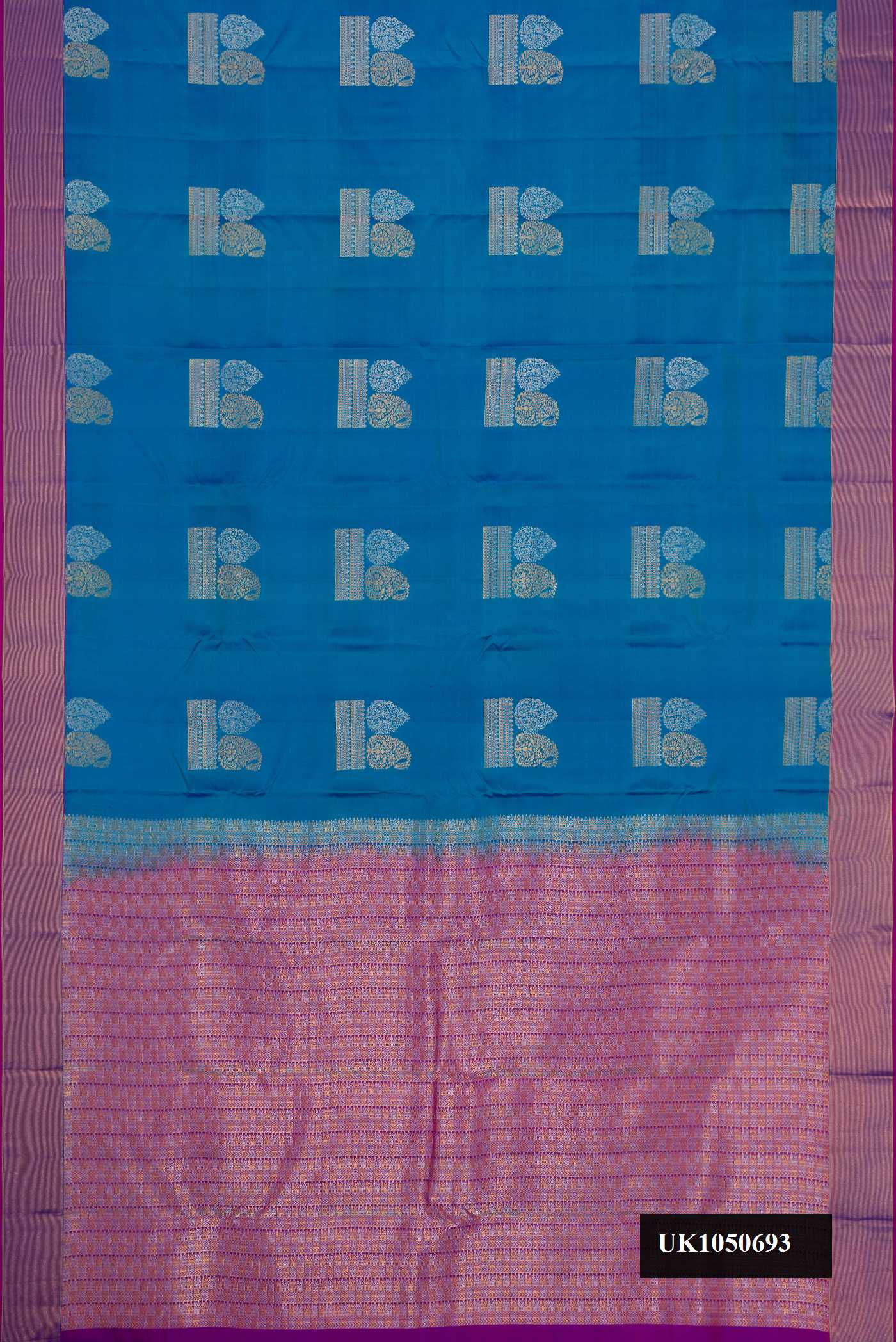 Peacock Blue Dual Tone Kanchipuram Silk Saree with Zari Butta on the body and Zari Border.  displayed on a mannequin