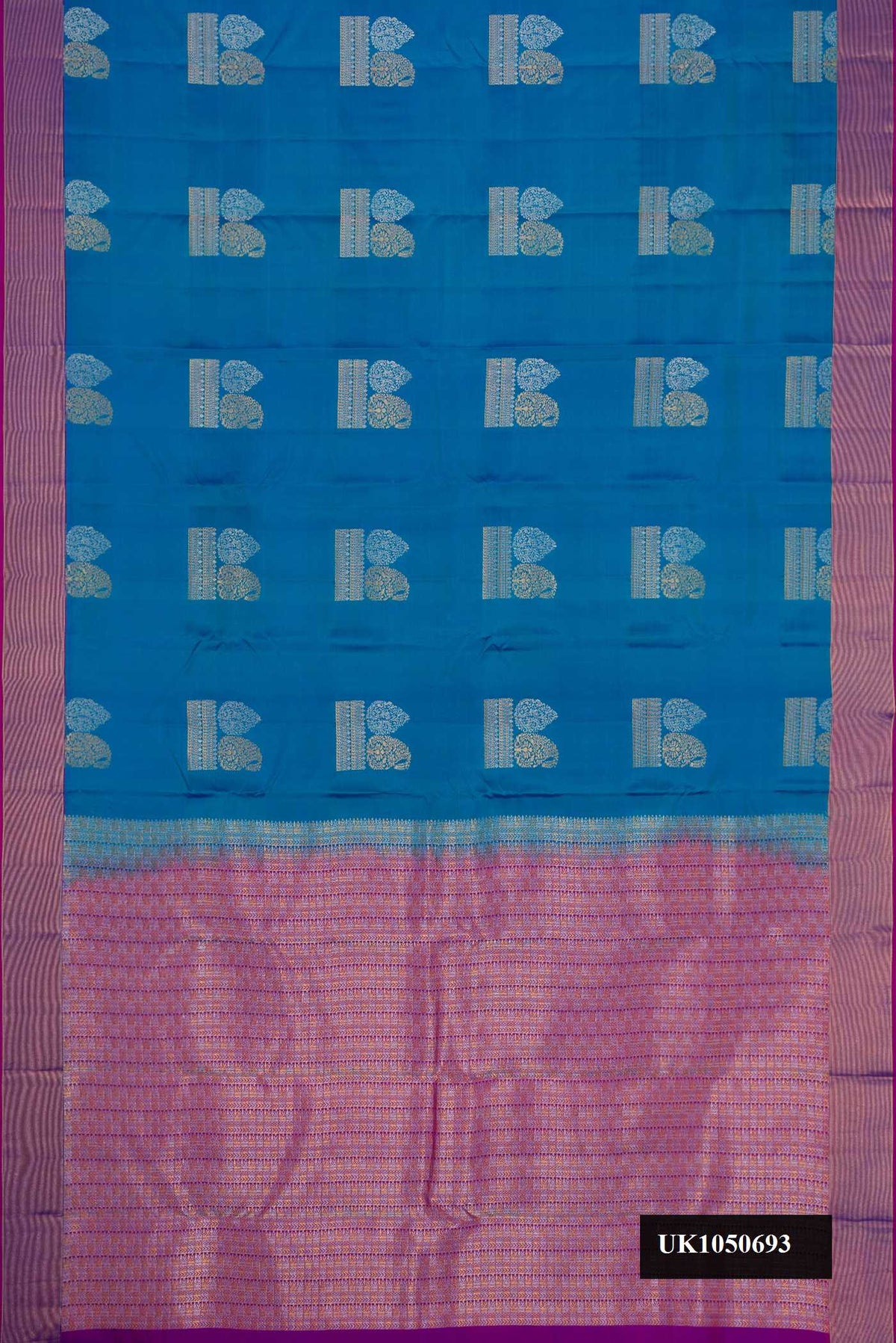 Peacock Blue Dual Tone Kanchipuram Silk Saree with Zari Butta on the body and Zari Border.  displayed on a mannequin