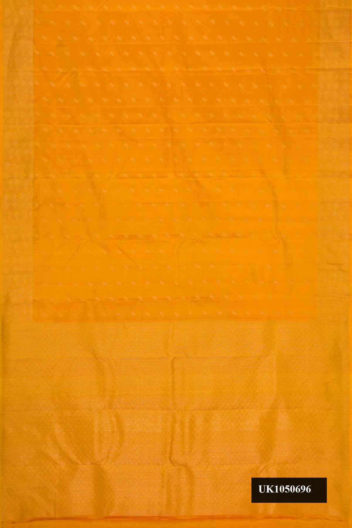 Mustard Dual Tone Kanchipuram Silk Saree with Zari Butta on the body and Zari Border.  displayed on a mannequin