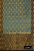 Light Green Dual Tone Kanchipuram Silk Saree with Zari Butta on the body and Zari Border.  displayed on a mannequin