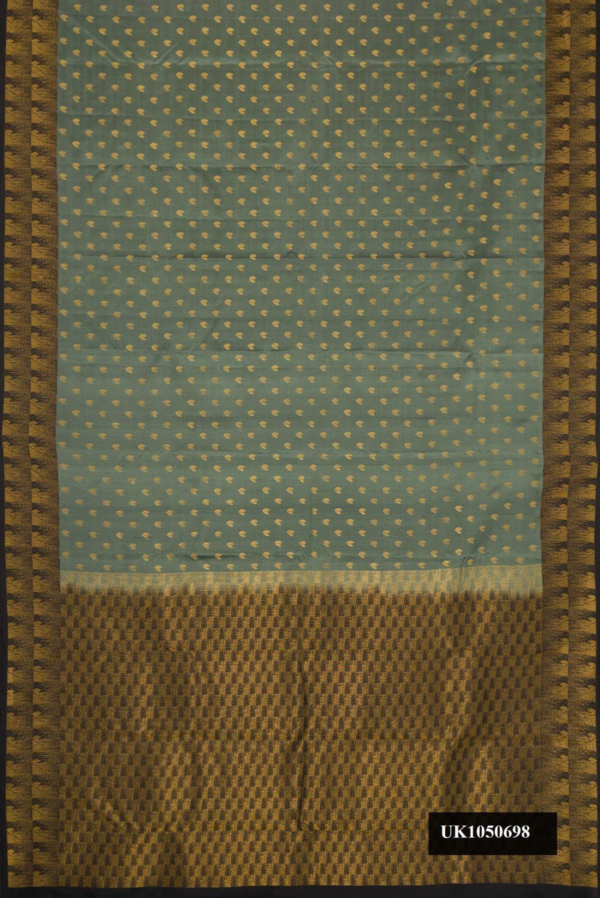 Light Green Dual Tone Kanchipuram Silk Saree with Zari Butta on the body and Zari Border.  displayed on a mannequin