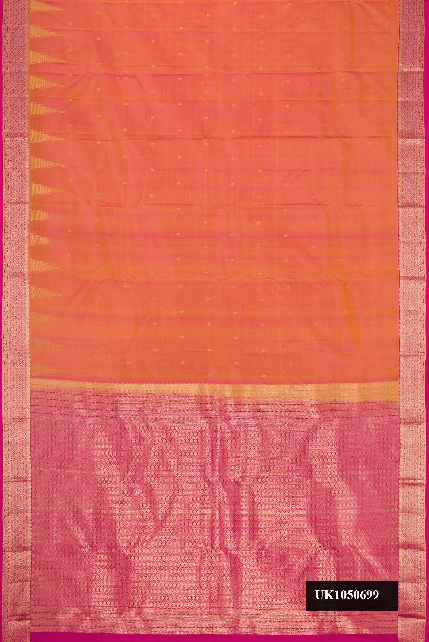 Coral Dual Tone Kanchipuram Silk Saree with Zari Butta on the body and Zari Border.  displayed on a mannequin