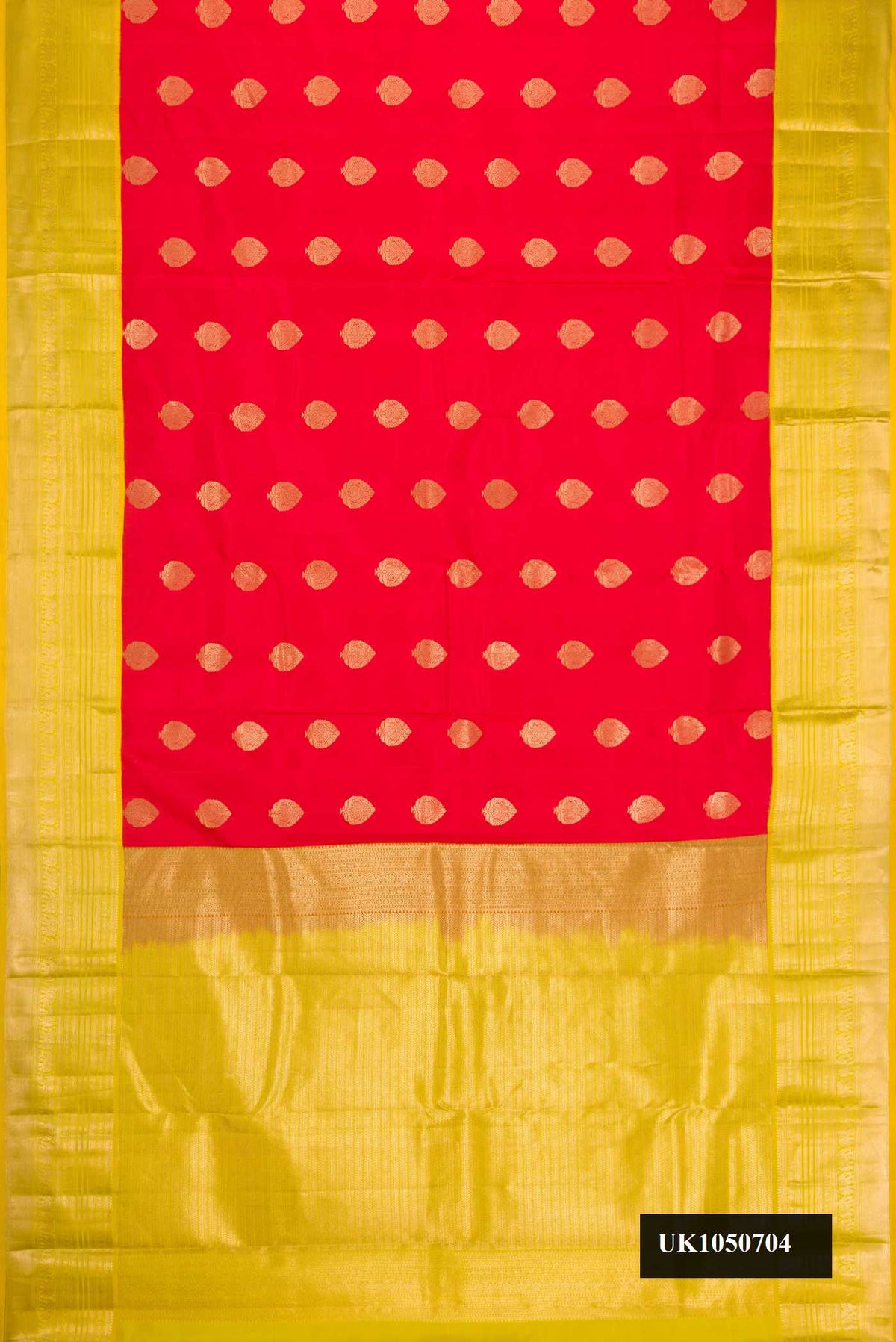 Red Dual Tone Kanchipuram Silk Saree with Zari Butta on the body and Zari Border.  displayed on a mannequin