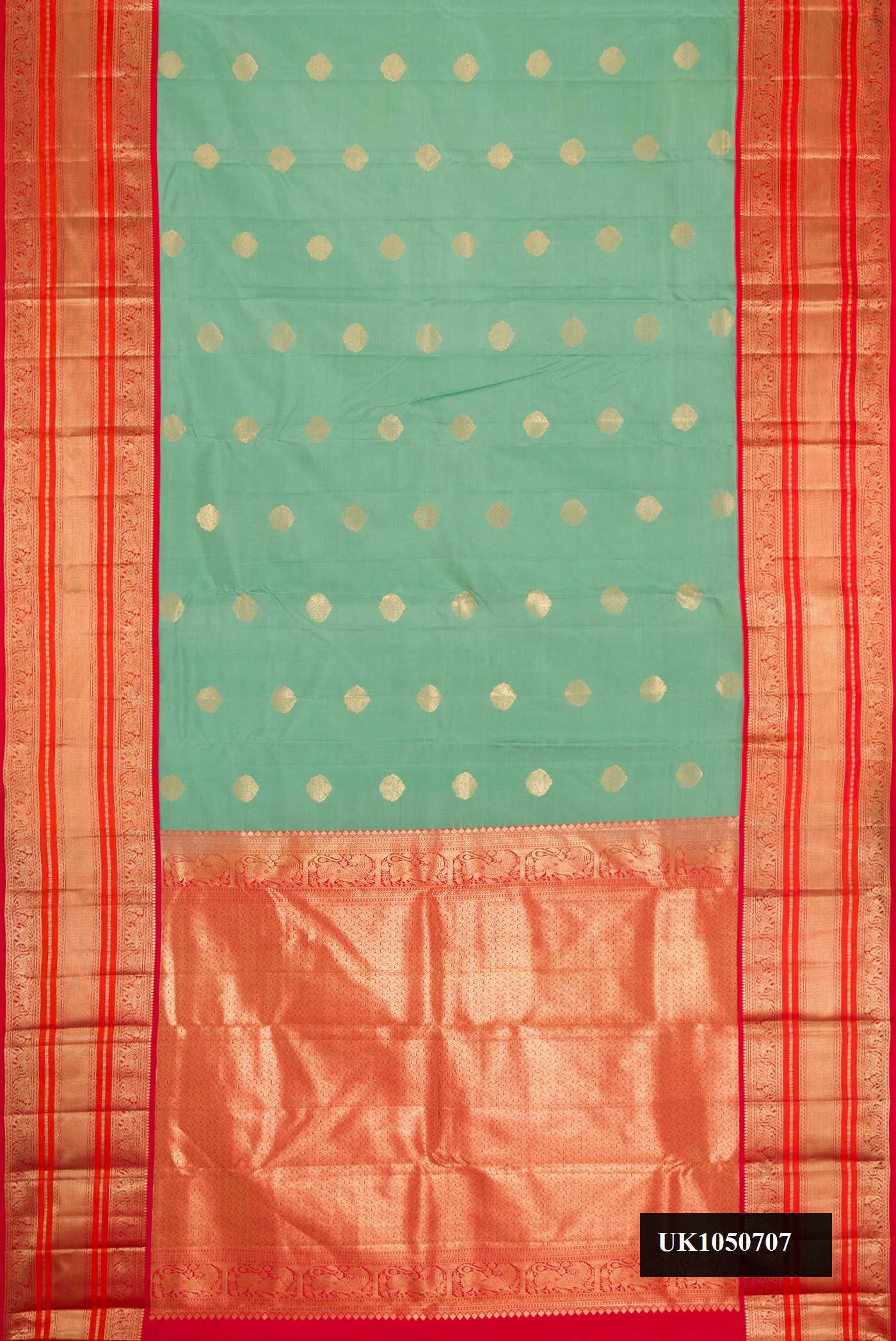 Pista Green Dual Tone Kanchipuram Silk Saree with Zari Butta on the body and Zari Border.  displayed on a mannequin