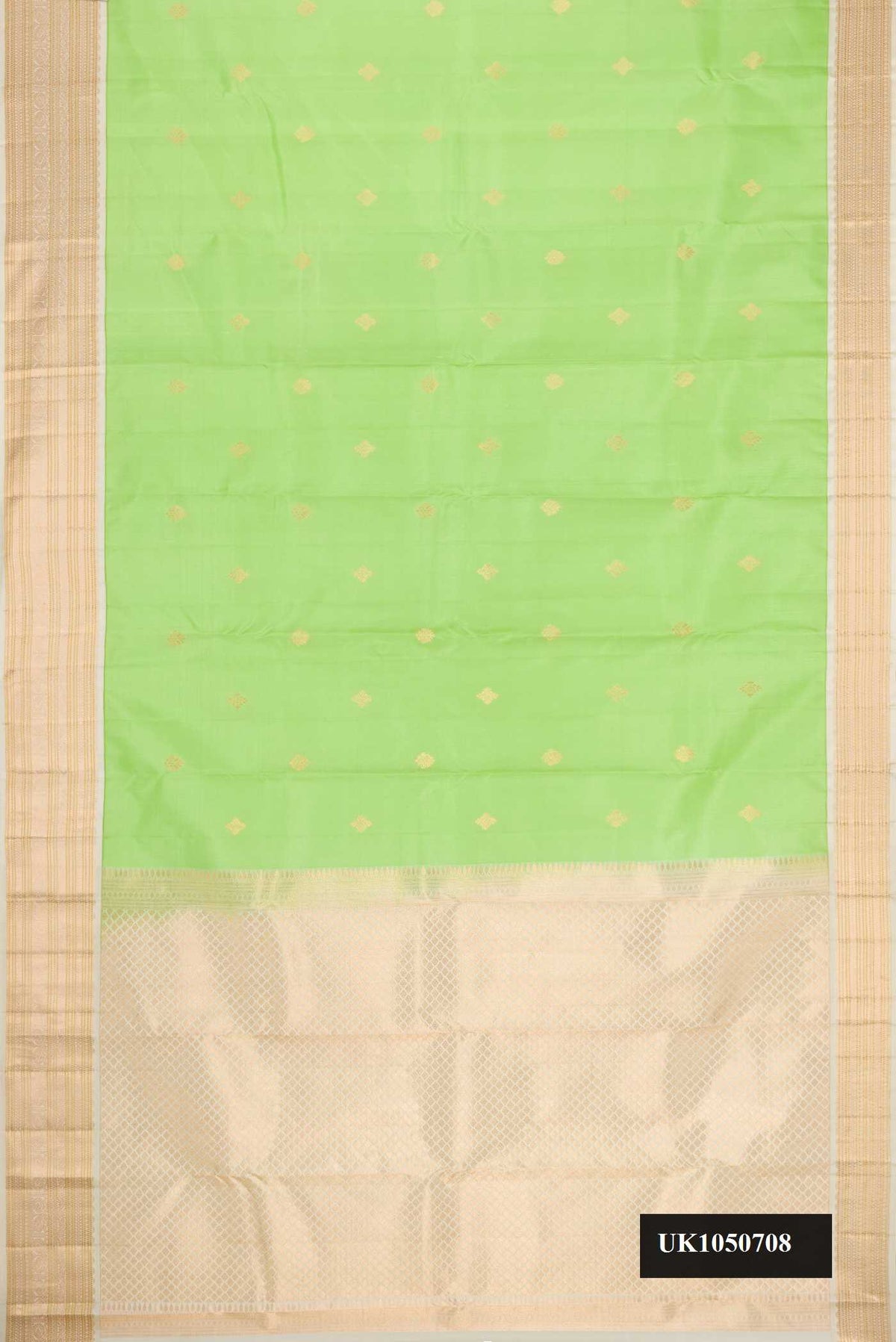 Parrot Green Dual Tone Kanchipuram Silk Saree with Zari Butta on the body and Zari Border.  displayed on a mannequin