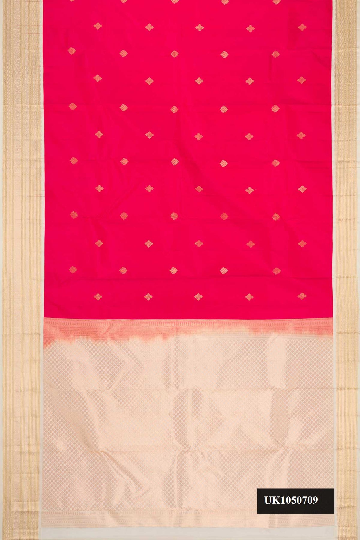 Dark Pink Dual Tone Kanchipuram Silk Saree with Zari Butta on the body and Zari Border.  displayed on a mannequin
