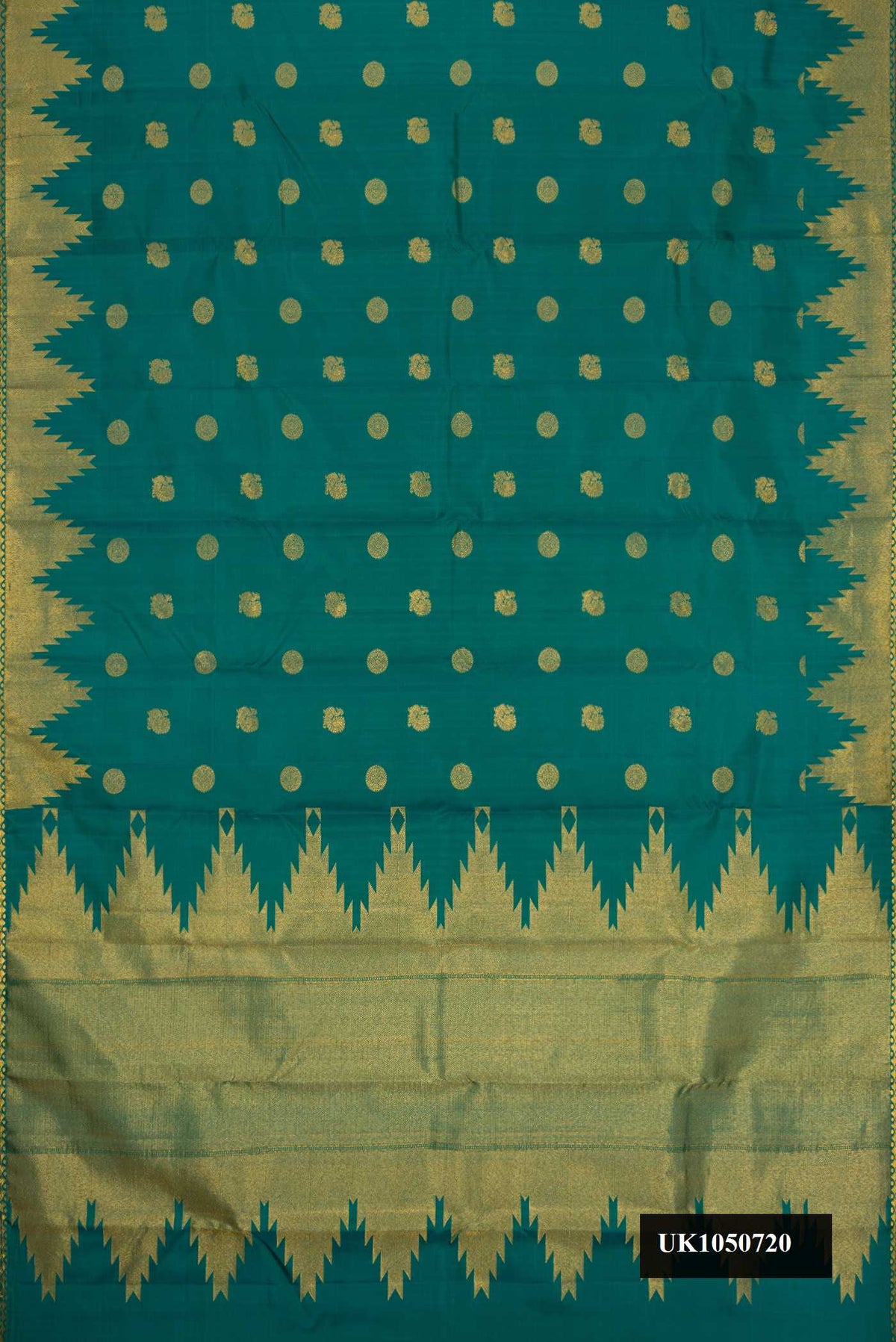 Green Dual Tone Kanchipuram Silk Saree with Zari Butta on the body and Zari Border.  displayed on a mannequin