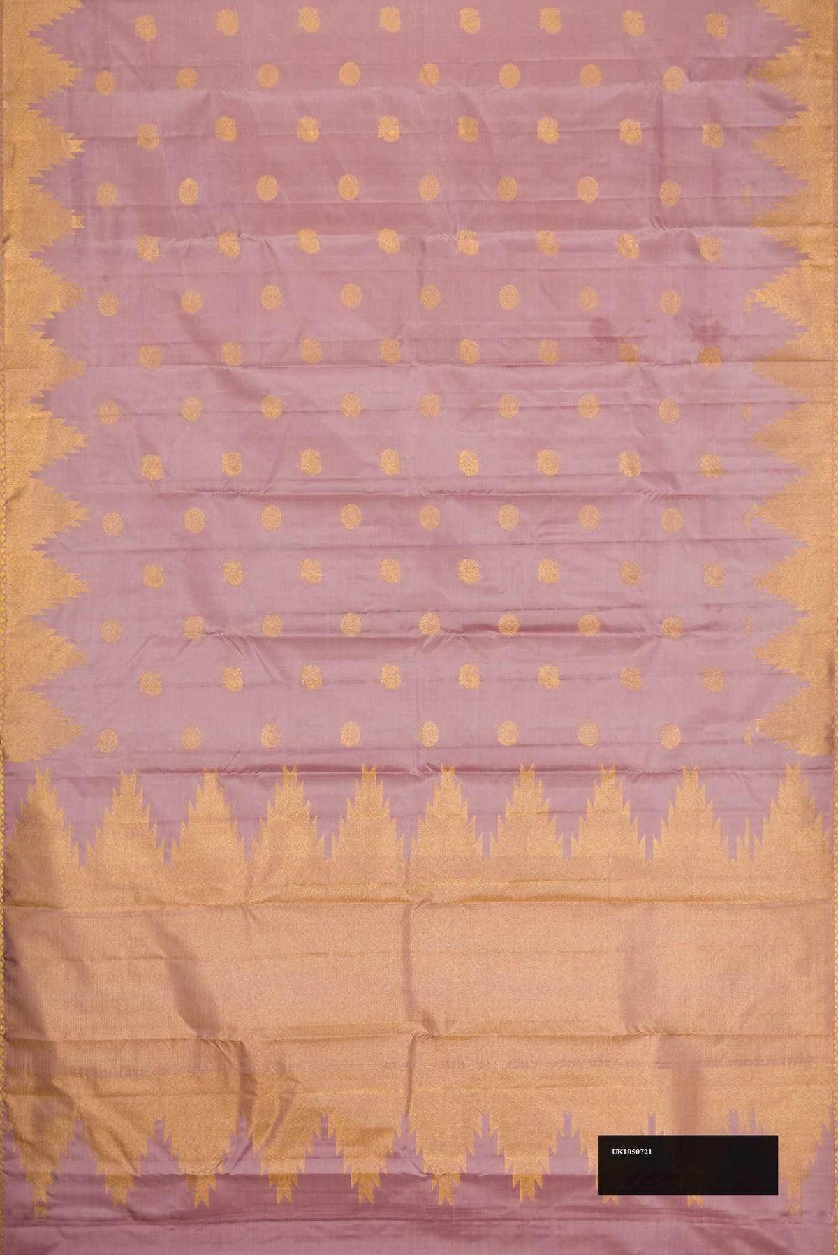 Lilac Dual Tone Kanchipuram Silk Saree with Zari Butta on the body and Temple Border.  displayed on a mannequin