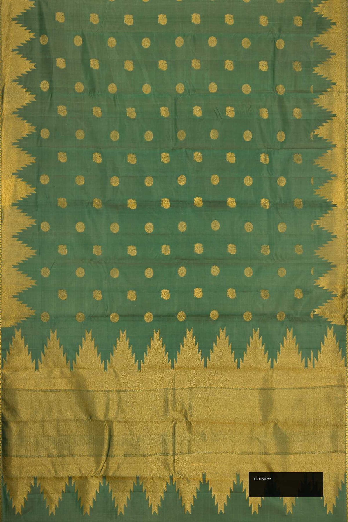 Green Dual Tone Kanchipuram Silk Saree with Zari Butta on the body and Temple Border.  displayed on a mannequin