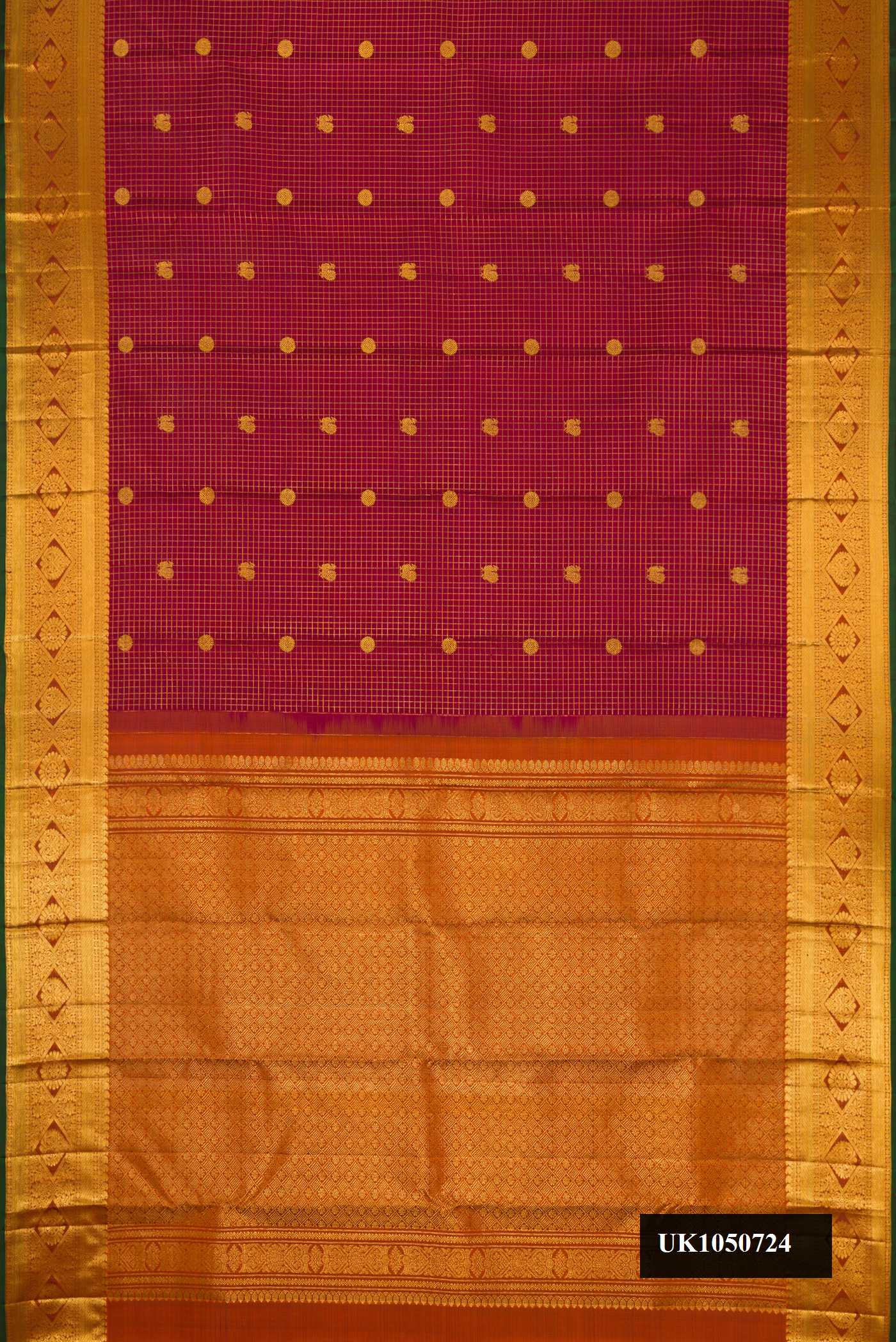 Maroon Dual Tone Kanchipuram Silk Saree with Checked design on the body and Zari Border.  displayed on a mannequin