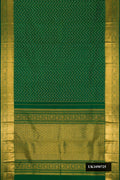 Bottle Green Dual Tone Kanchipuram Silk Saree with Zari Butta on the body and Zari Border.  displayed on a mannequin