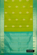 Parrot Green Dual Tone Kanchipuram Silk Saree with Zari Butta on the body and Zari Border.  displayed on a mannequin