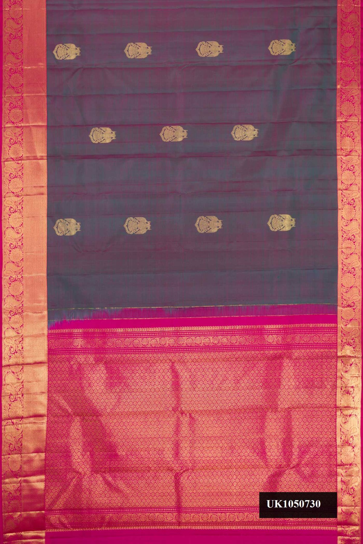 Purple Dual Tone Kanchipuram Silk Saree with Zari Butta on the body and Zari Border.  displayed on a mannequin