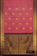 Rose Gold Dual Tone Kanchipuram Silk Saree with Zari Butta on the body and Zari Border.  displayed on a mannequin