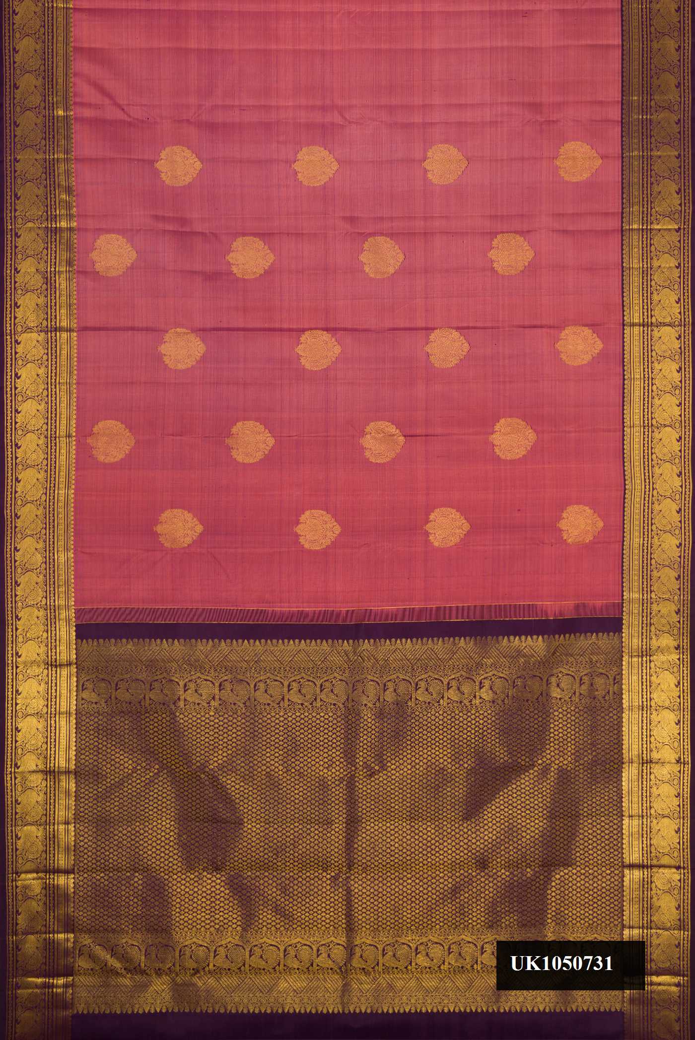 Rose Gold Dual Tone Kanchipuram Silk Saree with Zari Butta on the body and Zari Border.  displayed on a mannequin
