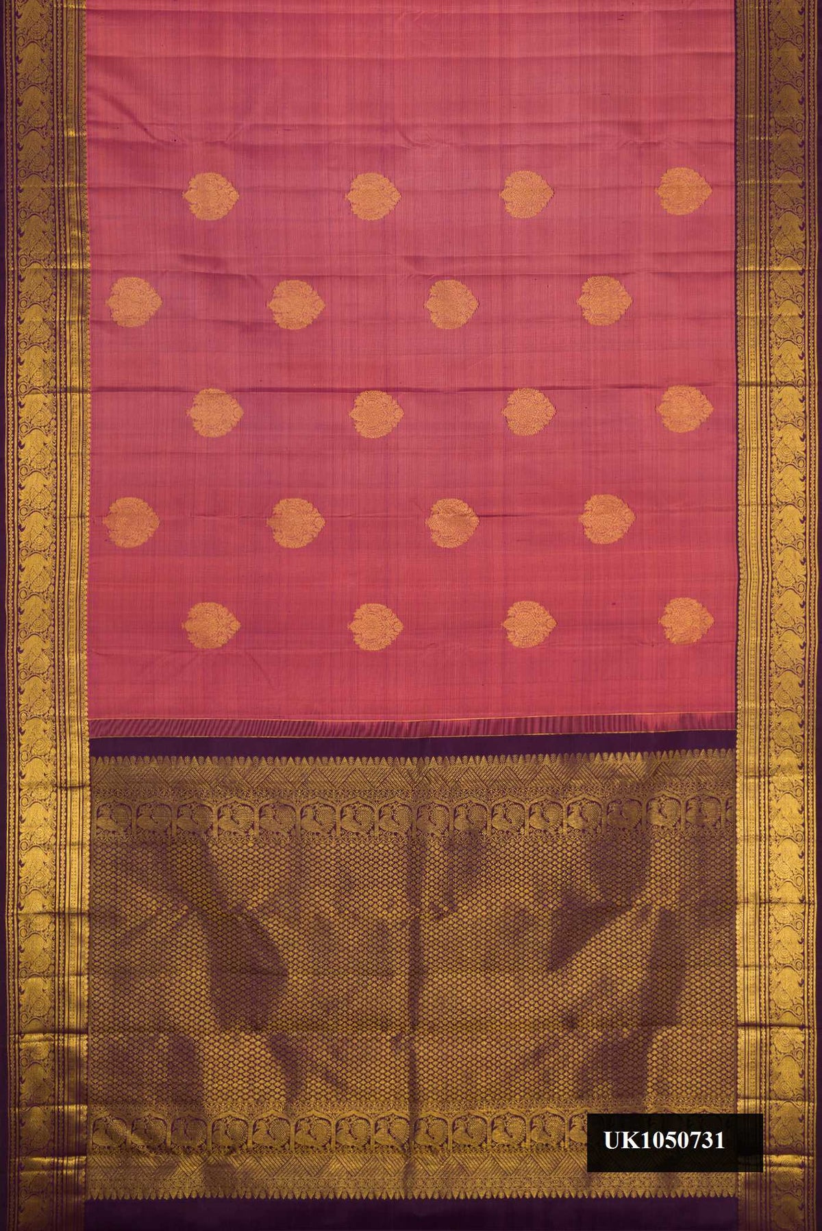 Rose Gold Dual Tone Kanchipuram Silk Saree with Zari Butta on the body and Zari Border.  displayed on a mannequin