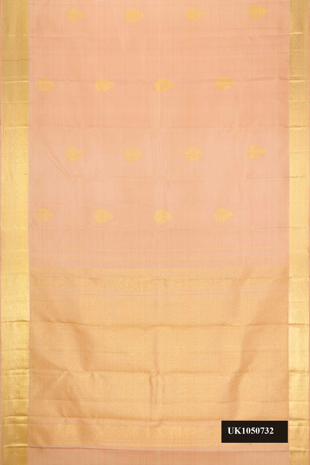 Golden Peach Dual Tone Kanchipuram Silk Saree with Zari Butta on the body and Zari Border.  displayed on a mannequin