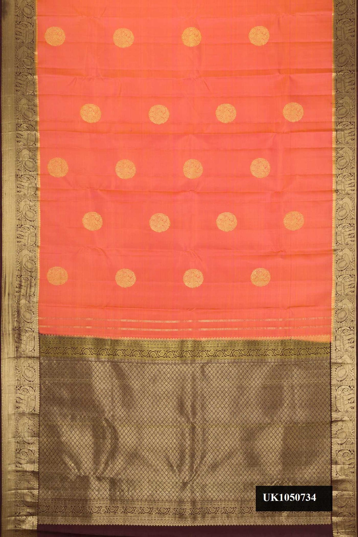 Peach Dual Tone Kanchipuram Silk Saree with Zari Butta on the body and Zari Border.  displayed on a mannequin