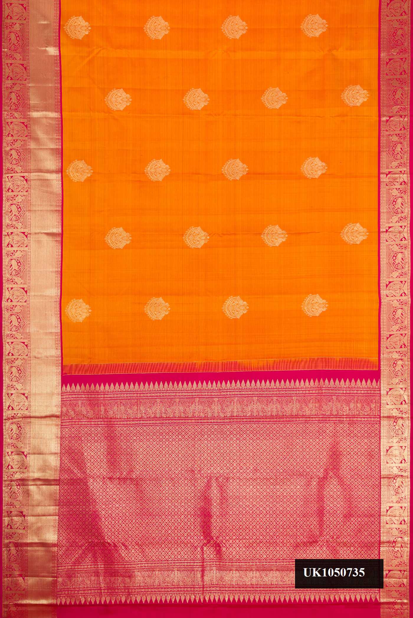 Mustard Dual Tone Kanchipuram Silk Saree with Zari Butta on the body and Zari Border.  displayed on a mannequin