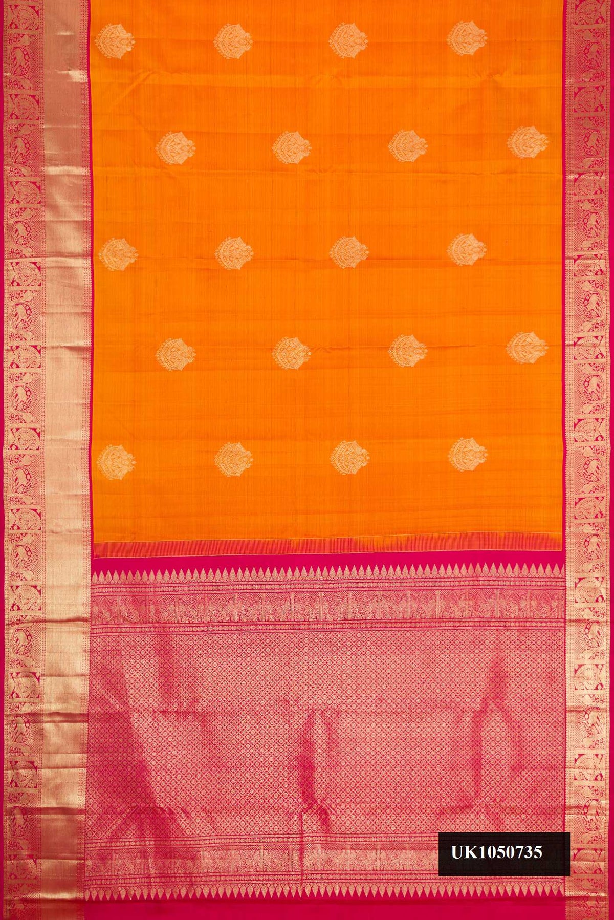 Mustard Dual Tone Kanchipuram Silk Saree with Zari Butta on the body and Zari Border.  displayed on a mannequin