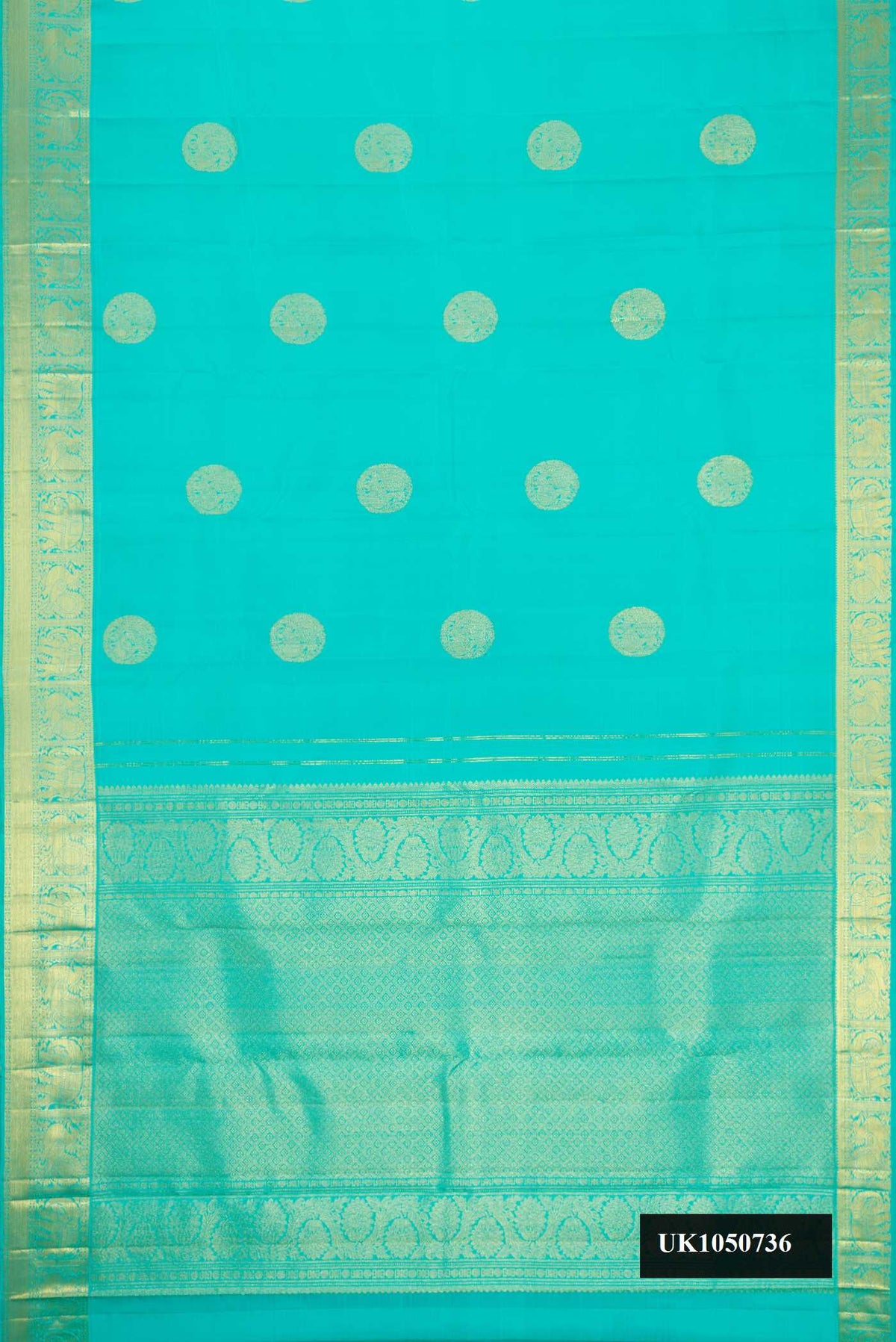 Sky Blue Dual Tone Kanchipuram Silk Saree with Zari Butta on the body and Zari Border.  displayed on a mannequin