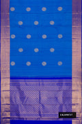 Sky Blue Dual Tone Kanchipuram Silk Saree with Zari Butta on the body and Zari Border.  displayed on a mannequin