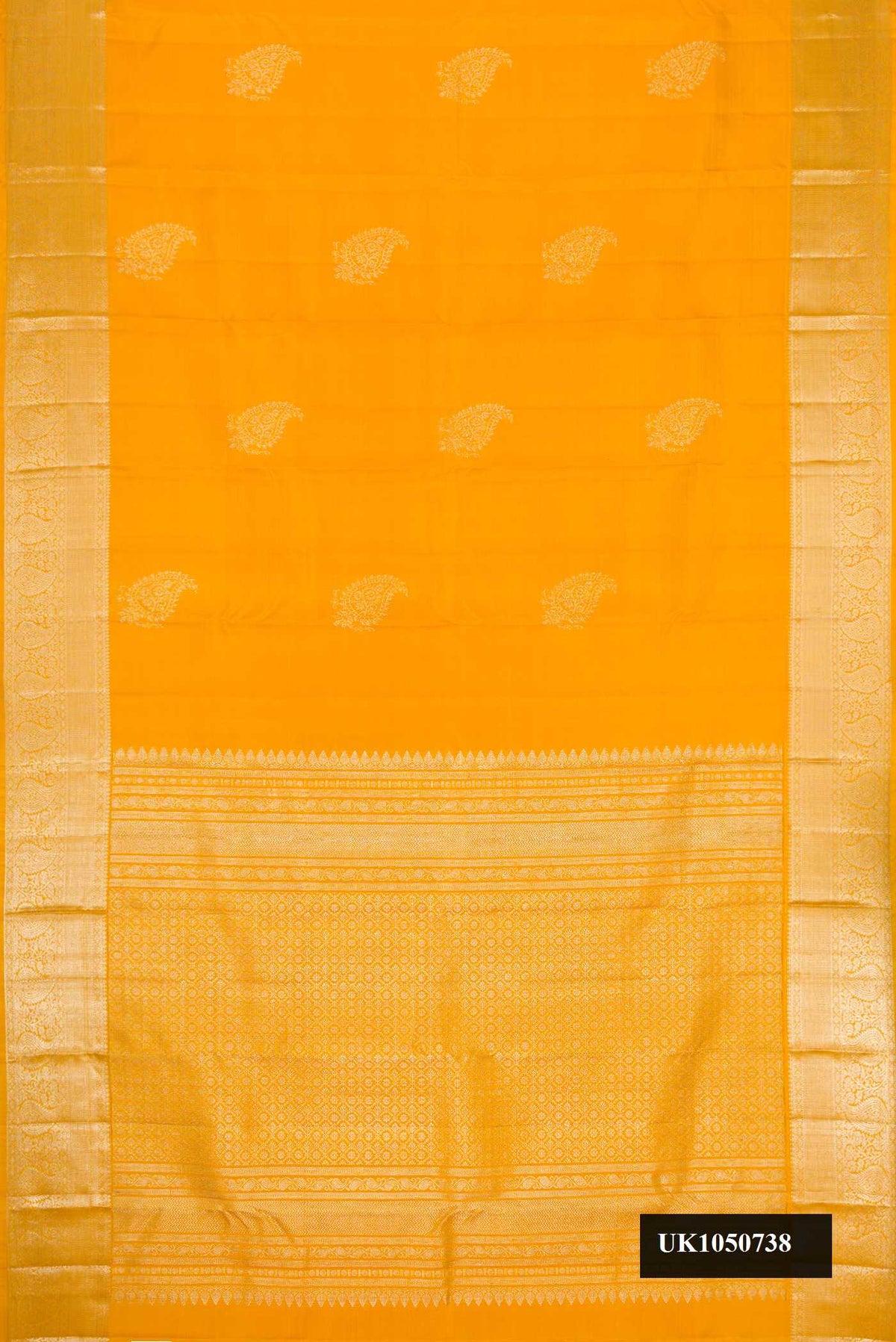 Mustard Dual Tone Kanchipuram Silk Saree with Zari Butta on the body and Zari Border.  displayed on a mannequin