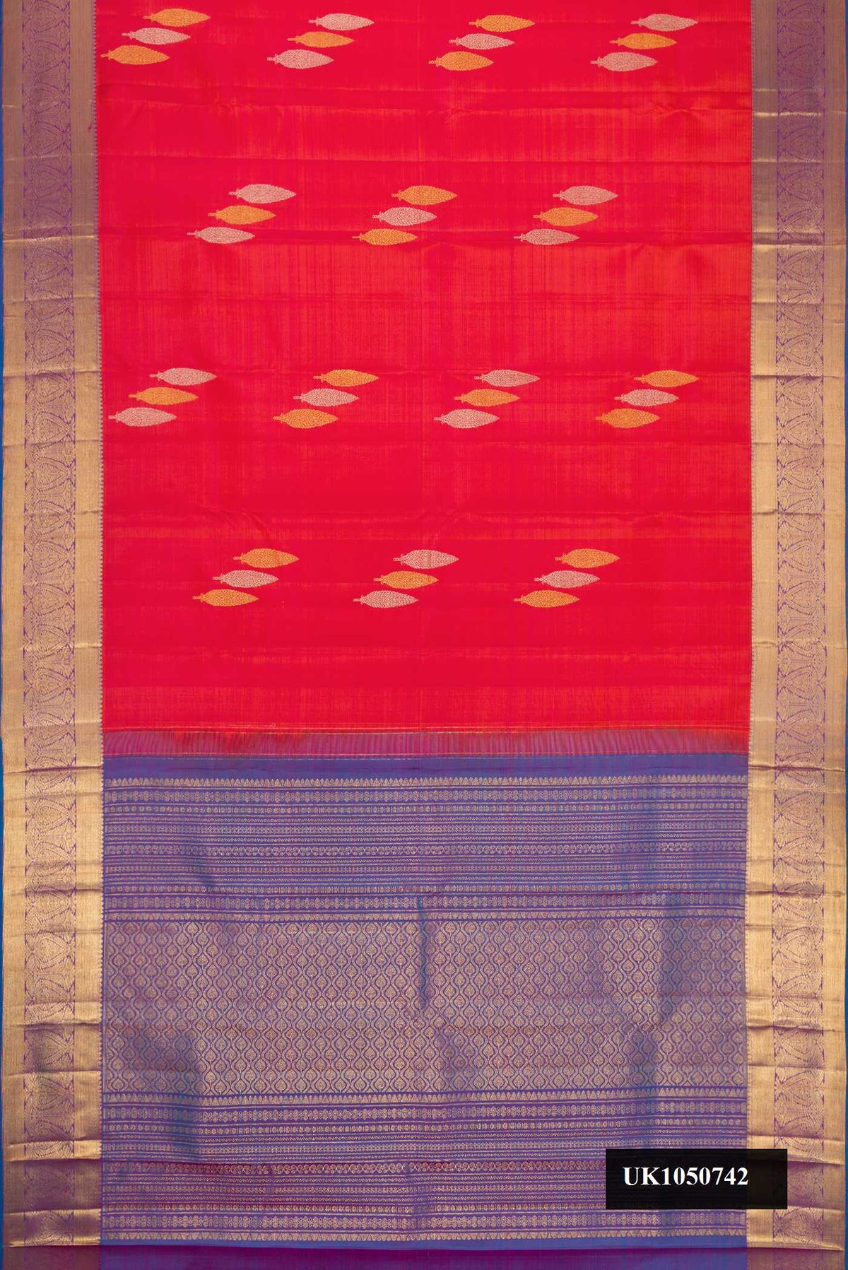 Brick Orange Dual Tone Kanchipuram Silk Saree with Zari Butta on the body and Zari Border.  displayed on a mannequin