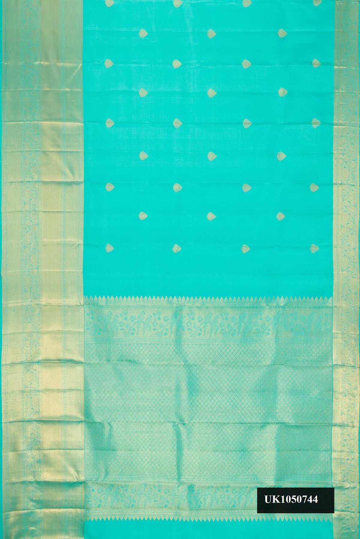 Sky Blue Dual Tone Kanchipuram Silk Saree with Zari Butta on the body and Zari Border.  displayed on a mannequin