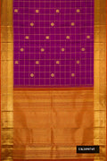 Magenta Dual Tone Kanchipuram Silk Saree with Checked design on the body and Zari Border.  displayed on a mannequin