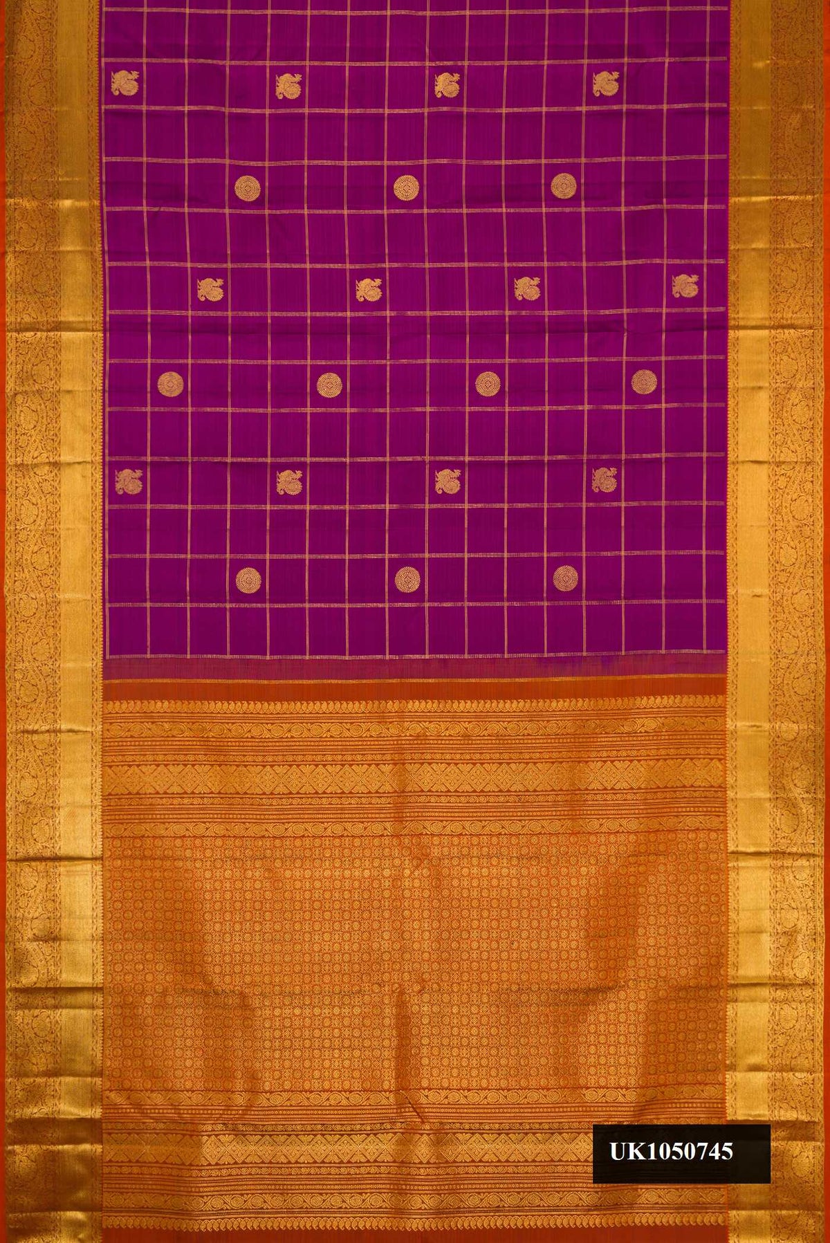 Magenta Dual Tone Kanchipuram Silk Saree with Checked design on the body and Zari Border.  displayed on a mannequin