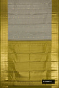 Grey Dual Tone Kanchipuram Silk Saree with Zari Butta on the body and Zari Border.  displayed on a mannequin