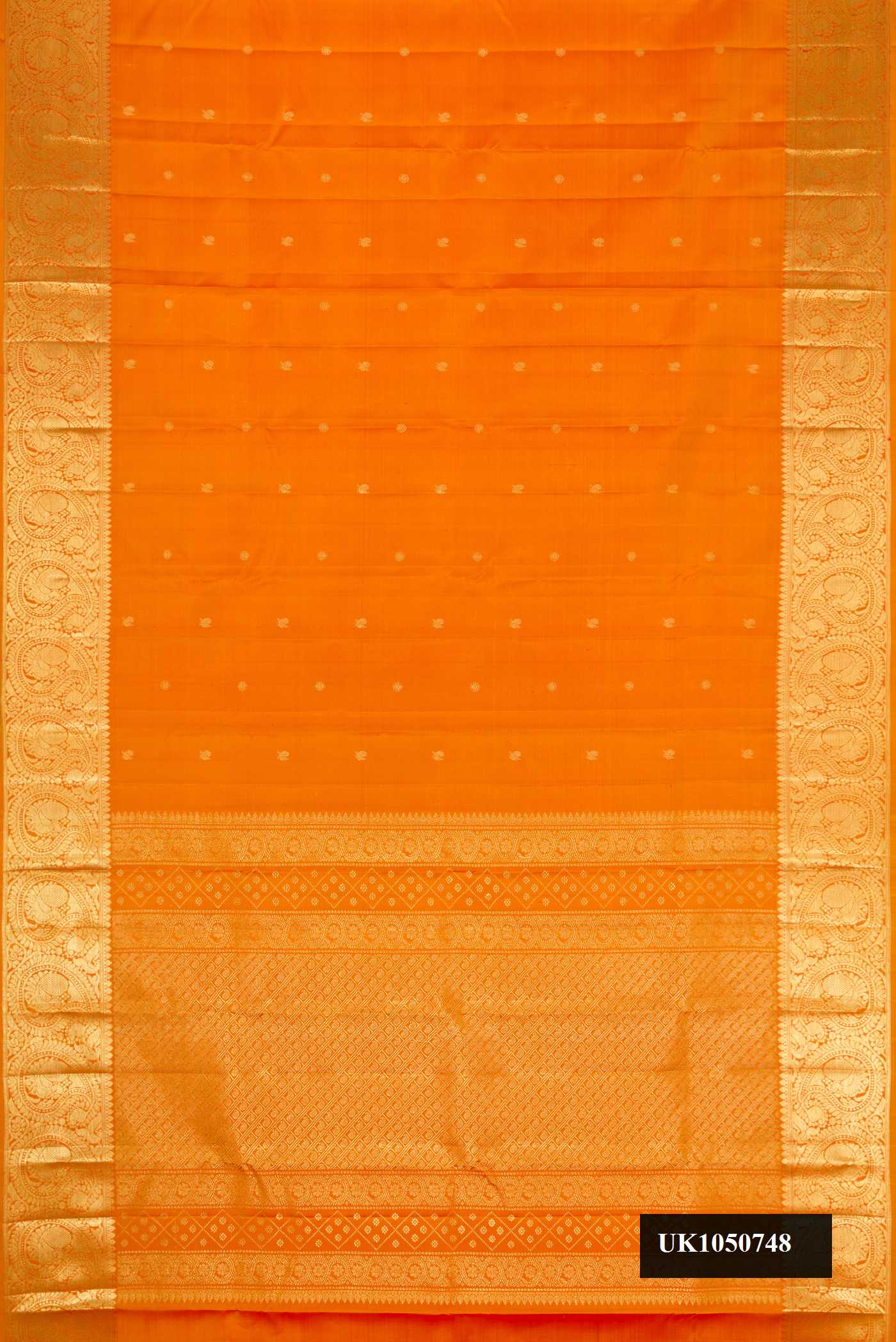 Mustard Dual Tone Kanchipuram Silk Saree with Zari Butta on the body and Zari Border.  displayed on a mannequin