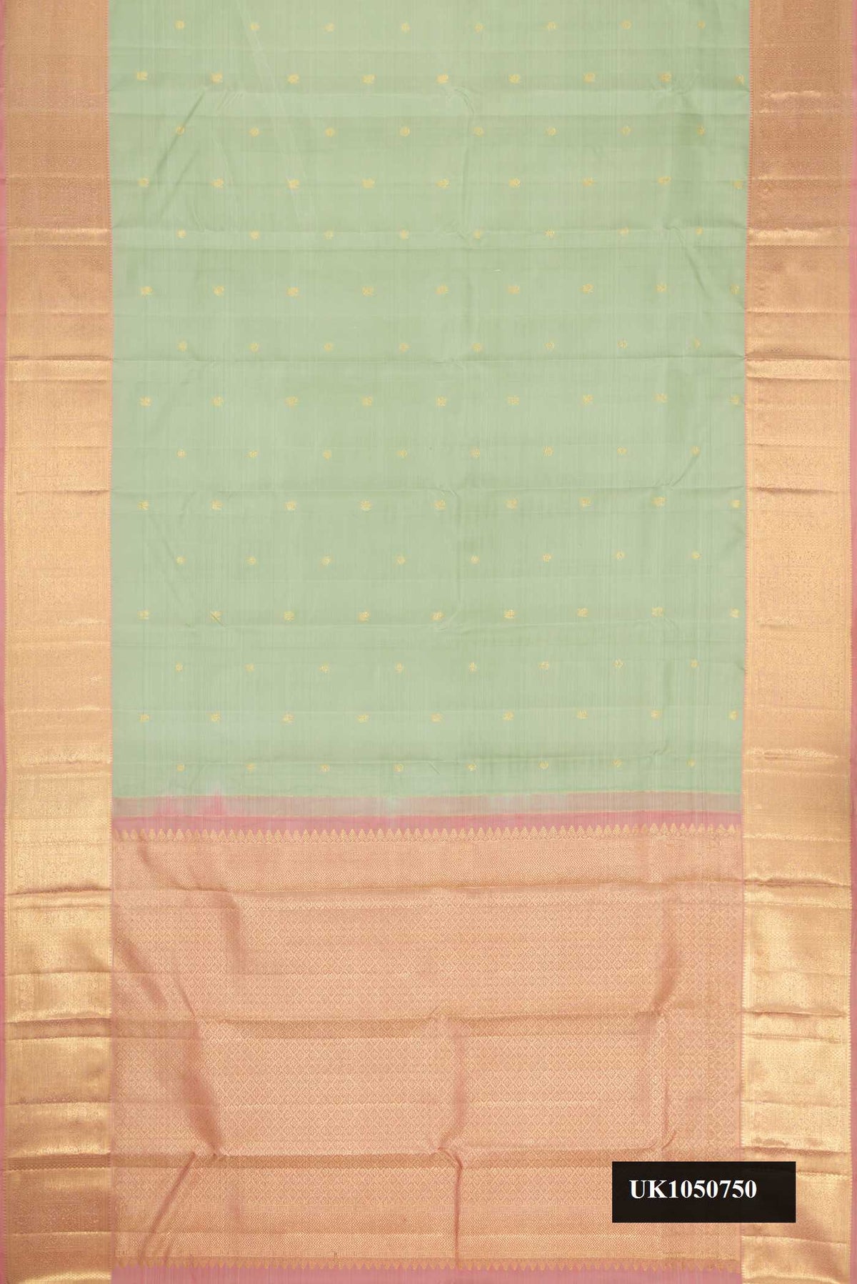 Pista Green Dual Tone Kanchipuram Silk Saree with Zari Butta on the body and Zari Border.  displayed on a mannequin
