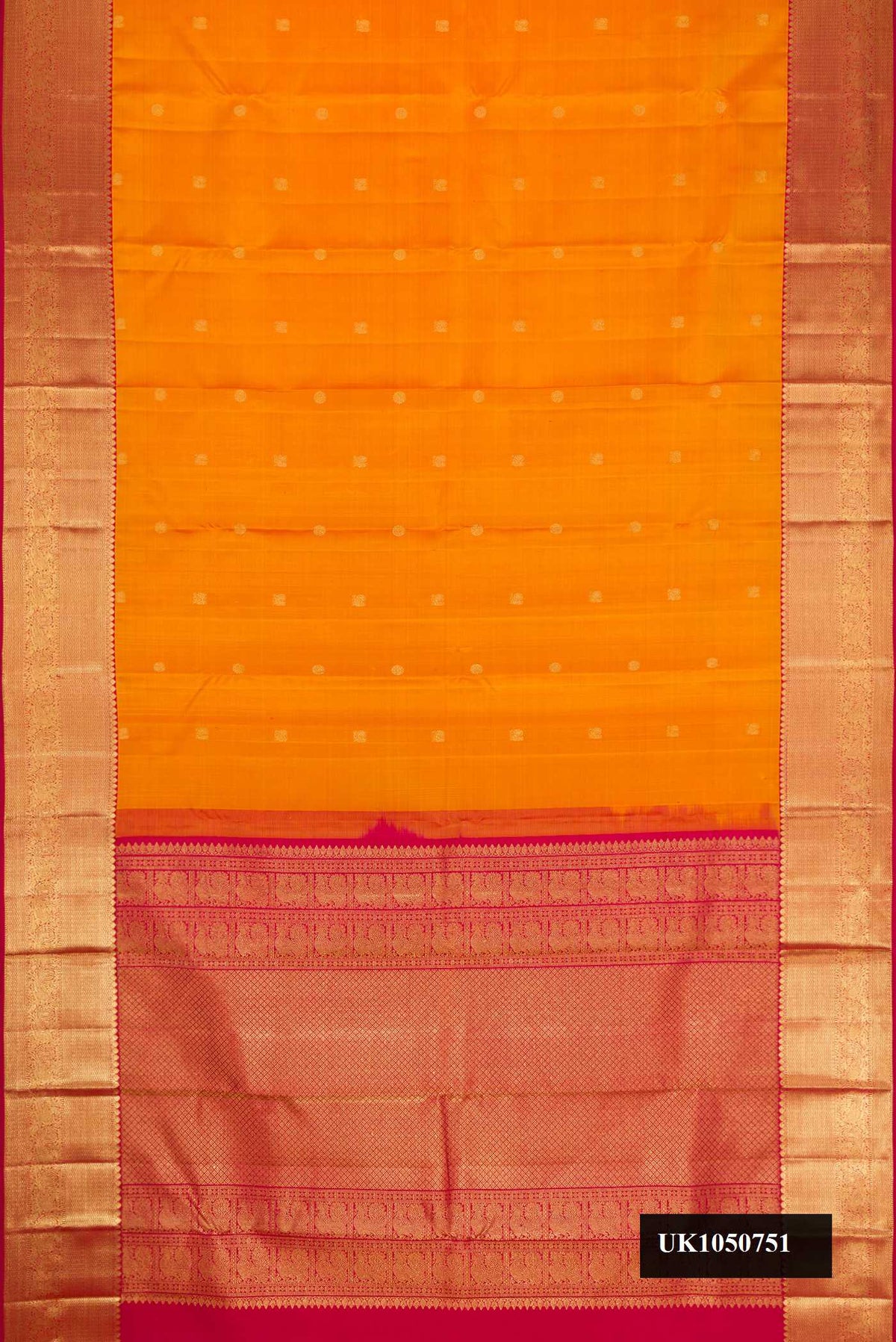 Mustard Dual Tone Kanchipuram Silk Saree with Zari Butta on the body and Zari Border.  displayed on a mannequin