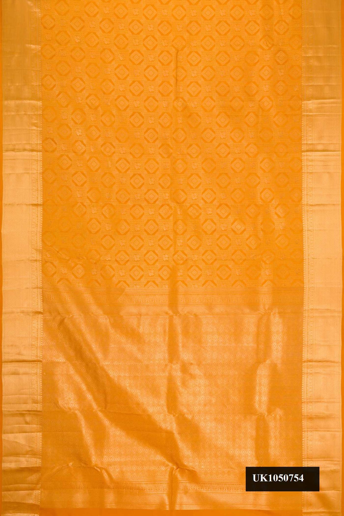 Mustard Dual Tone Kanchipuram Silk Saree with Zari Brocade on the body and Zari Border.  displayed on a mannequin