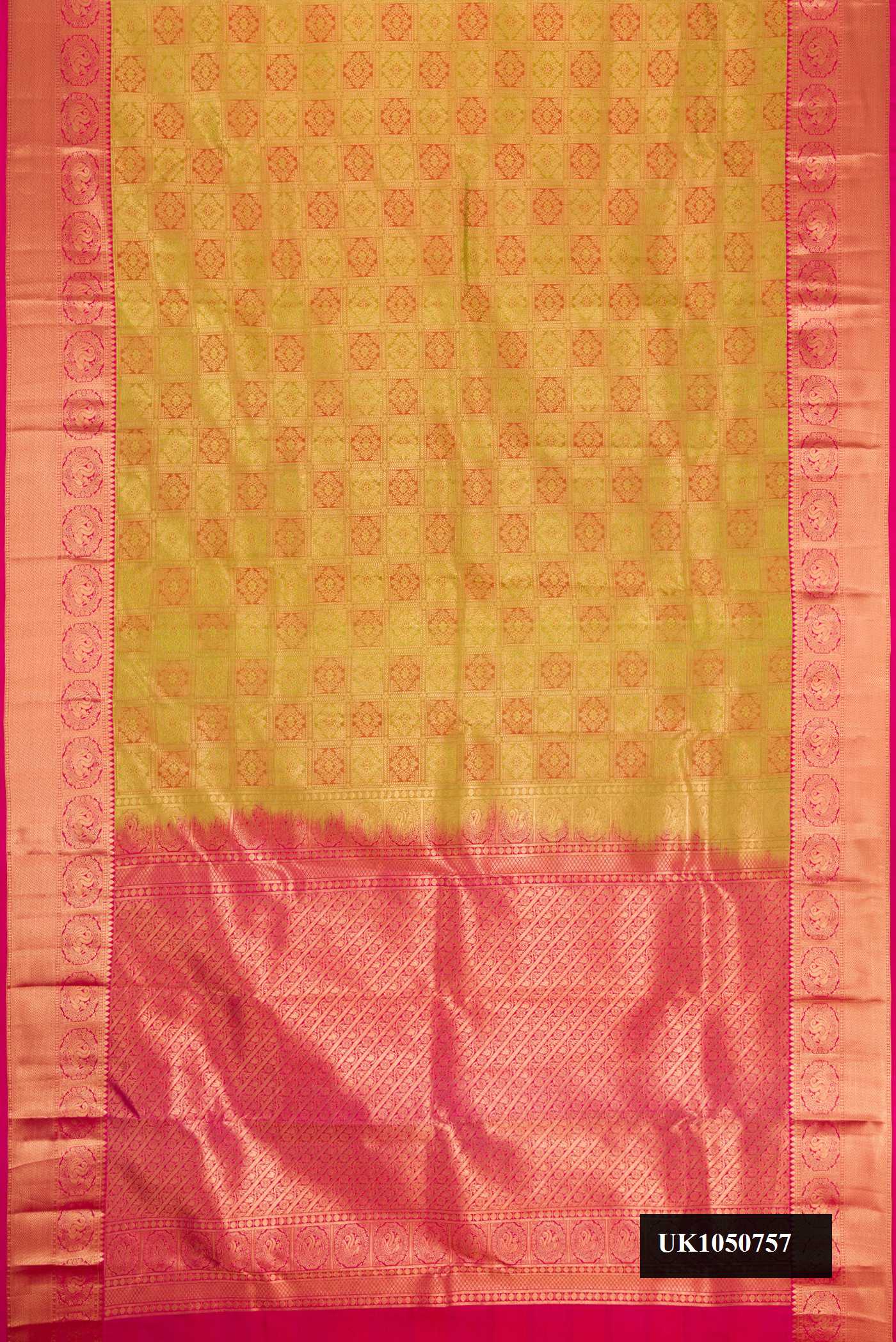 Mehandi Green Dual Tone Kanchipuram Silk Saree with Zari Brocade on the body and Zari Border.  displayed on a mannequin