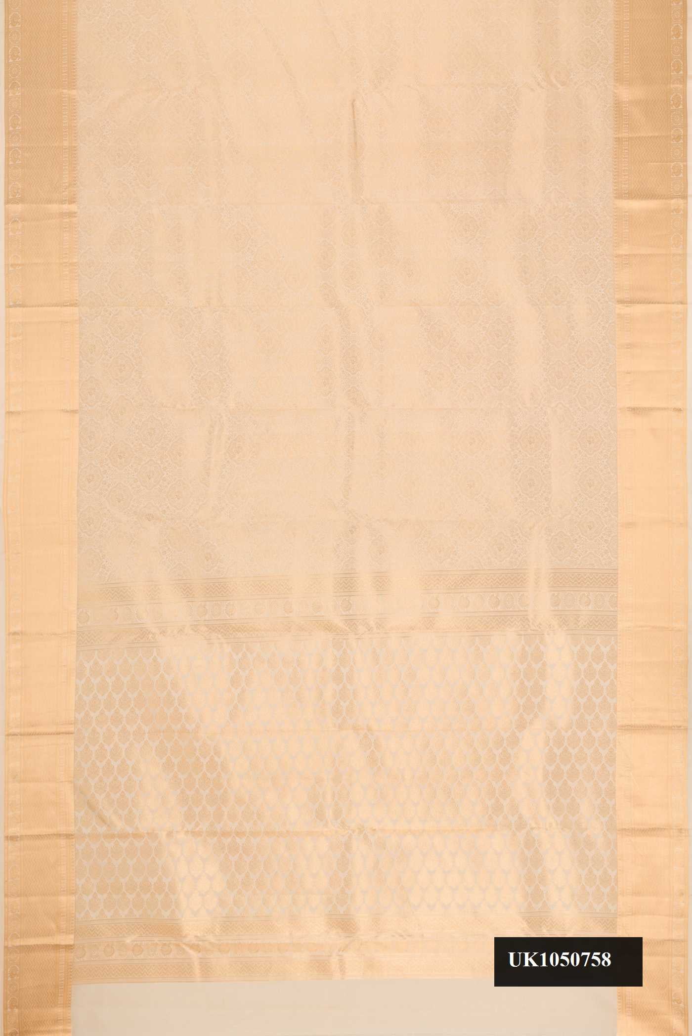 Beige Dual Tone Kanchipuram Silk Saree with Zari Brocade on the body and Zari Border.  displayed on a mannequin