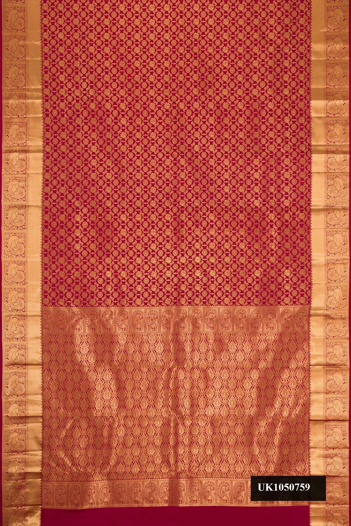Maroon Dual Tone Kanchipuram Silk Saree with Zari Brocade on the body and Zari Border.  displayed on a mannequin