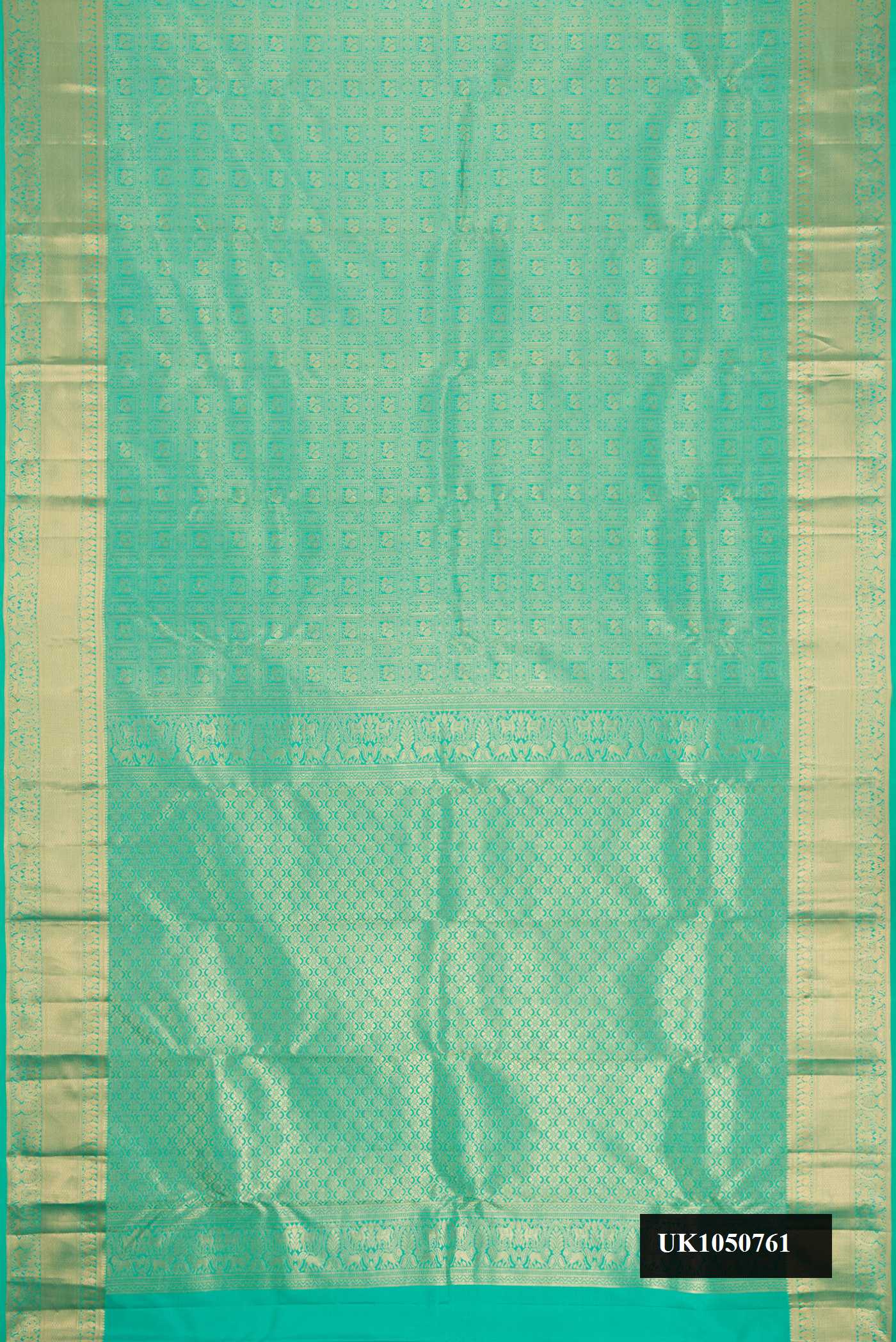 Green Dual Tone Kanchipuram Silk Saree with Zari Brocade on the body and Zari Border.  displayed on a mannequin