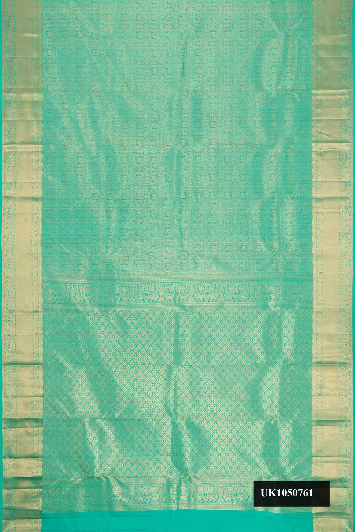 Green Dual Tone Kanchipuram Silk Saree with Zari Brocade on the body and Zari Border.  displayed on a mannequin