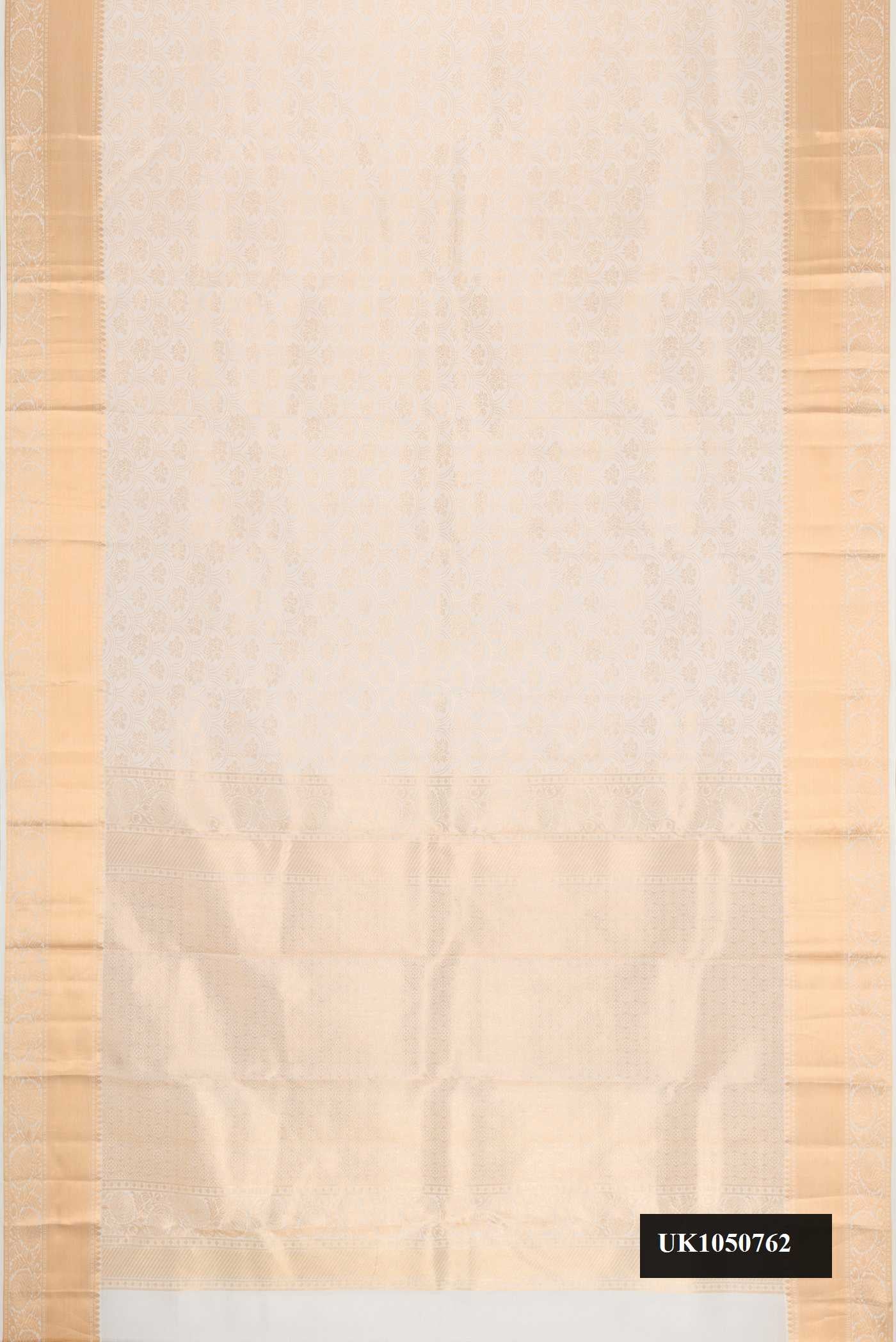Off White Dual Tone Kanchipuram Silk Saree with Zari Brocade on the body and Zari Border.  displayed on a mannequin