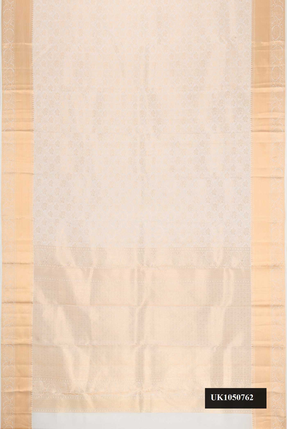 Off White Dual Tone Kanchipuram Silk Saree with Zari Brocade on the body and Zari Border.  displayed on a mannequin